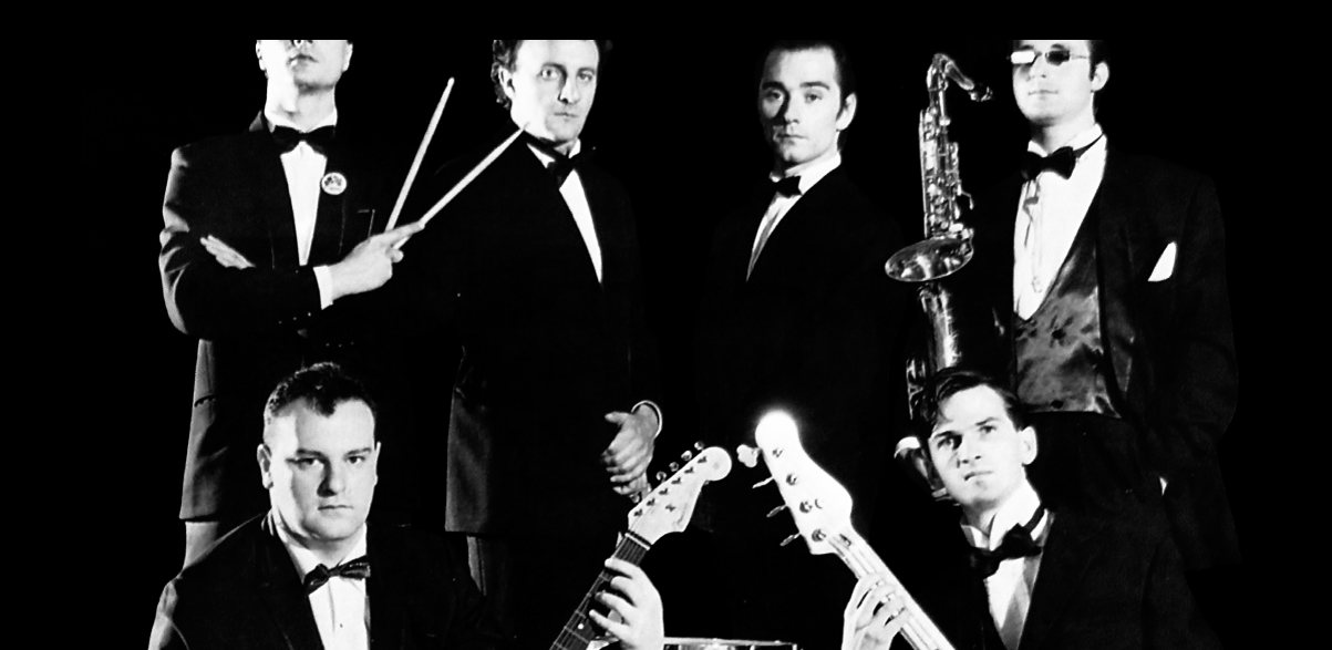 The Vindicators in tuxedos: the musicians at the top of the That's All Rock cover, 1987